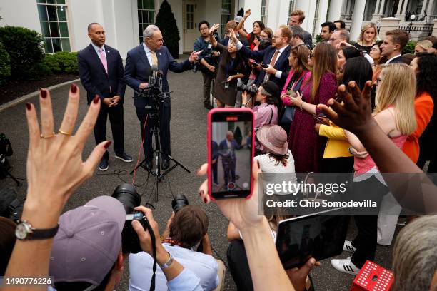 House Minority Leader Hakeem Jeffries and Senate Majority Leader Charles Schumer talk to reporters outside the West Wing following a meeting with...