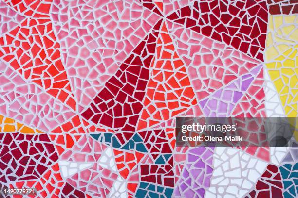 colorful broken pieces of ceramic tiles creating geometric shapes on exterior wall - mosaik bildbanksfoton och bilder