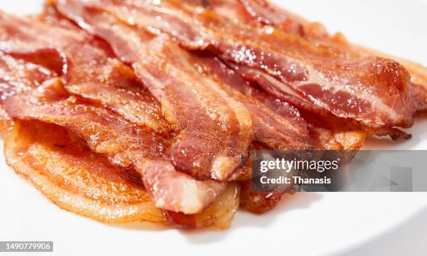fresh baked strips of bacon - bacon stock pictures, royalty-free photos & images