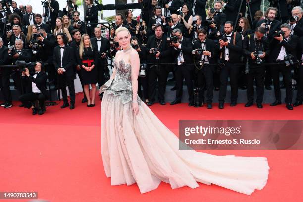 Elle Fanning attends the "Jeanne du Barry" Screening & opening ceremony red carpet at the 76th annual Cannes film festival at Palais des Festivals on...