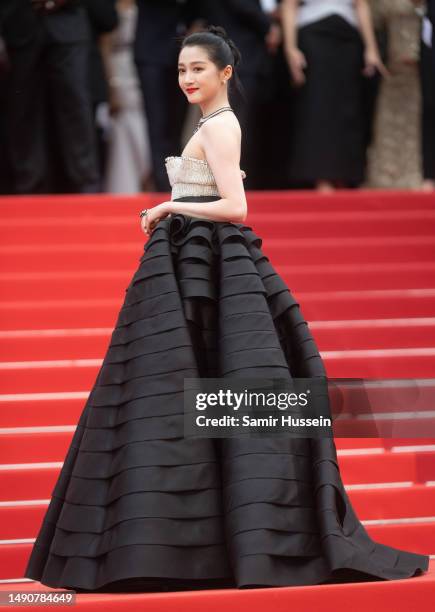 Guan Xiaotong attends the "Jeanne du Barry" Screening & opening ceremony red carpet at the 76th annual Cannes film festival at Palais des Festivals...