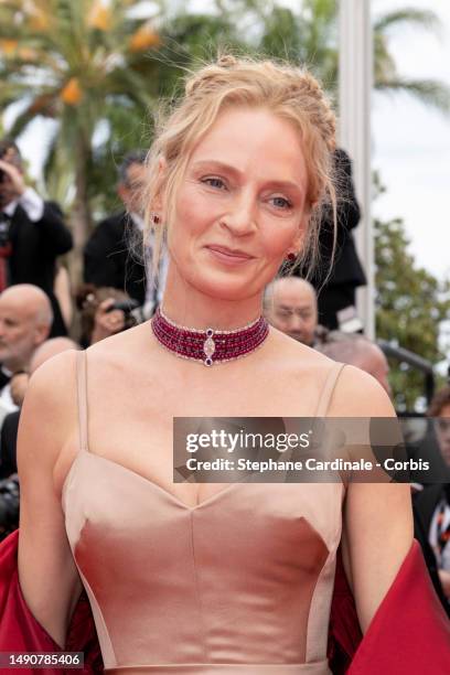 Uma Thurman attends the "Jeanne du Barry" Screening & opening ceremony red carpet at the 76th annual Cannes film festival at Palais des Festivals on...