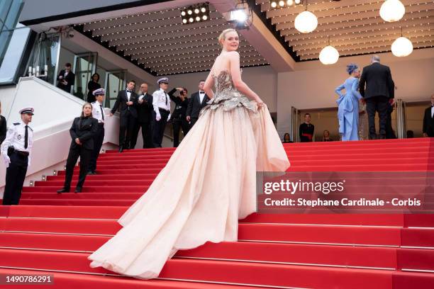 Elle Fanning attends the "Jeanne du Barry" Screening & opening ceremony red carpet at the 76th annual Cannes film festival at Palais des Festivals on...