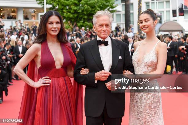 Catherine Zeta-Jones, Michael Douglas and Carys Zeta Douglas attend the "Jeanne du Barry" Screening & opening ceremony red carpet at the 76th annual...