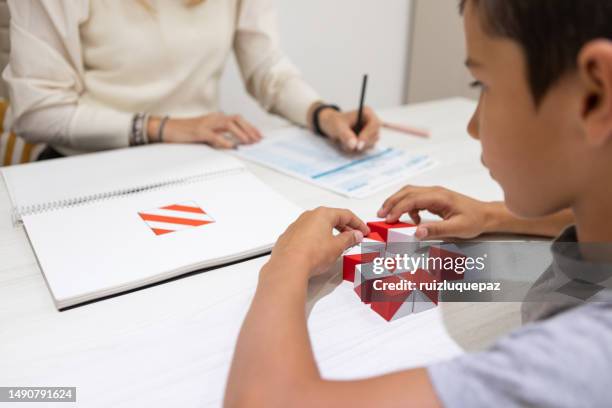 educational psychologist and patient boy - aspergers stock pictures, royalty-free photos & images