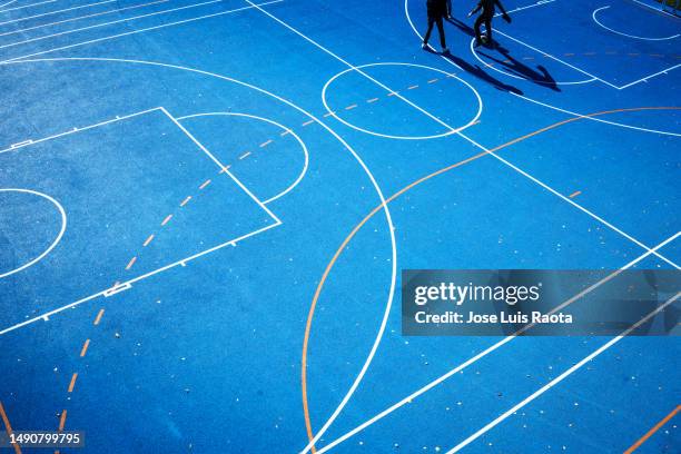 lines drawn on a basketball court - basketbalcompetitie stockfoto's en -beelden
