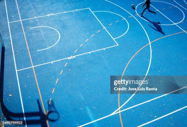 view of empty basketball court - basketball scoreboard stock pictures, royalty-free photos & images