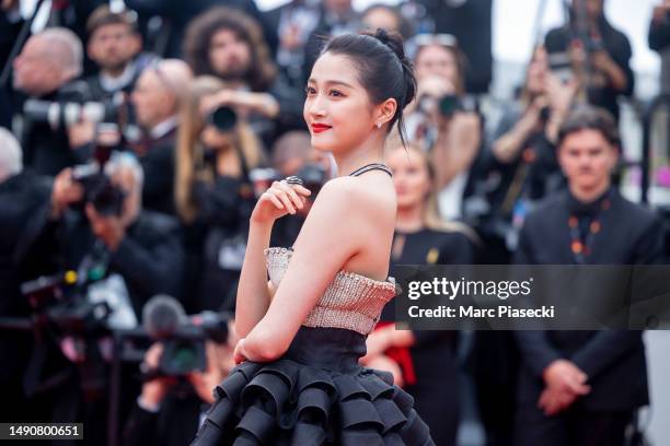 Guan Xiaotong attends the "Jeanne du Barry" Screening & opening ceremony red carpet at the 76th annual Cannes film festival at Palais des Festivals...