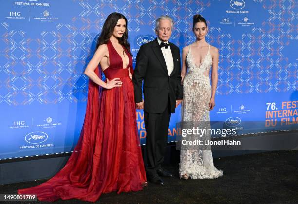 Catherine Zeta-Jones, Michael Douglas and Carys Zeta Douglas attend the opening ceremony gala dinner at the 76th annual Cannes film festival at...