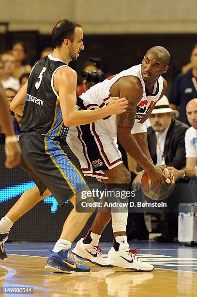 Kobe Bryant of the US Men's Senior National Team posts up against Emanuel Ginobili of the Argentina Men's Senior National Team at Palau Sant Jordi on...