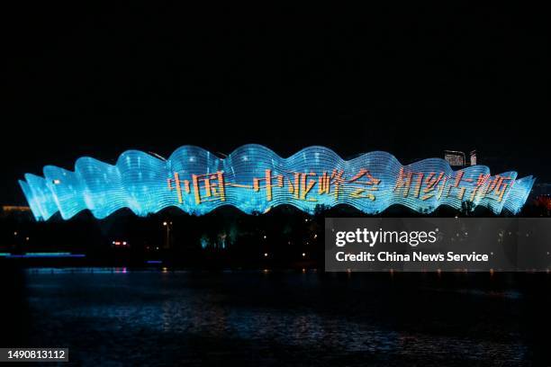 Chinese characters reading 'welcome China-Central Asia Summit' is displayed on the facade of Xi'an Olympic Sports Center on May 16, 2023 in Xi'an,...