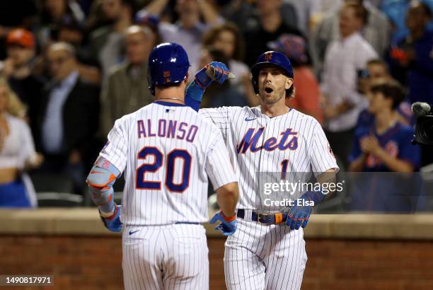 Jeff McNeil and Pete Alonso of the New York Mets celebrate after Alonso drove them both home with a two run home run in the seventh inning against...