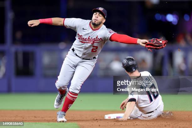 Luis Garcia of the Washington Nationals catches the ball over Joey Wendle of the Miami Marlins during the fifth inning at loanDepot park on May 16,...