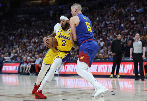 Anthony Davis of the Los Angeles Lakers drives to the basket against Nikola Jokic of the Denver Nuggets during the second quarter in game one of the...