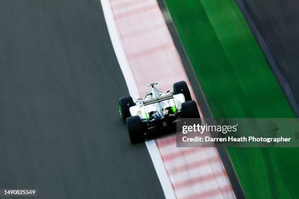 Braziiian Brawn Formula One racing team racing driver Rubens Barrichello driving his BGP 001 racing car at speed over the kerb during practice for...