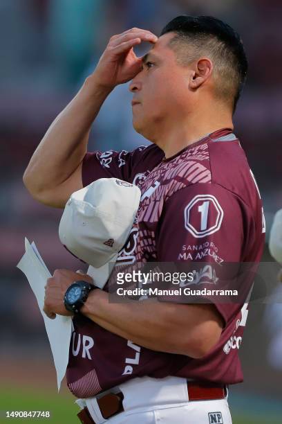 Oscar Robles manager of Algodoneros prays during the game between Sultanes de Monterrey and Algodoneros Union Laguna as part of Liga Mexicana de...