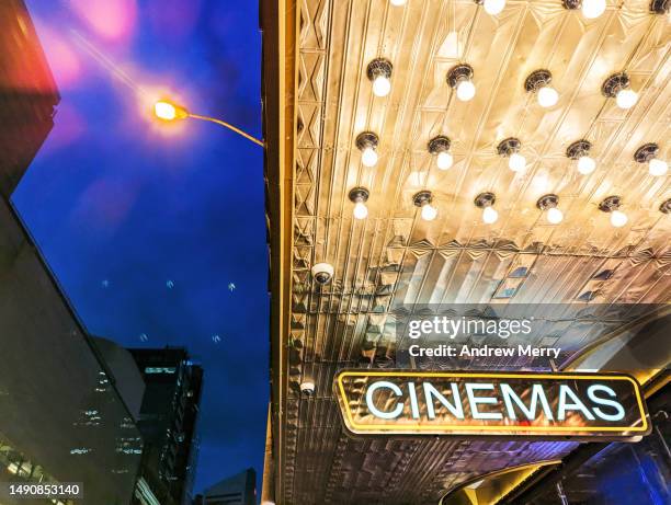 cinema sign city lights night - film screening outdoors stock pictures, royalty-free photos & images