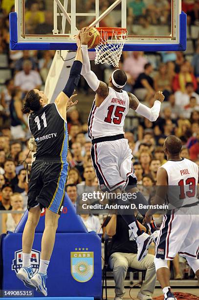 Carmelo Anthony of the US Men's Senior National Team blocks a shot by Martin Leiva of the Argentinean Men's Senior National Team at Palau Sant Jordi...