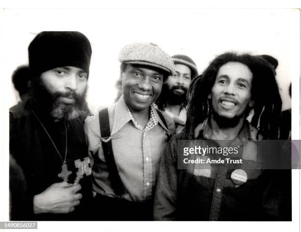 Fr. Amde Hamilton, John Otterbridge director of the Watts Towers art center, and reggae singer Bob Marley at an event hosted by Saint Tekle Haymonot...