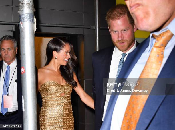 Meghan Markle, Duchess of Sussex, and Prince Harry, Duke of Sussex leave The Ziegfeld Theatre on May 16, 2023 in New York City.