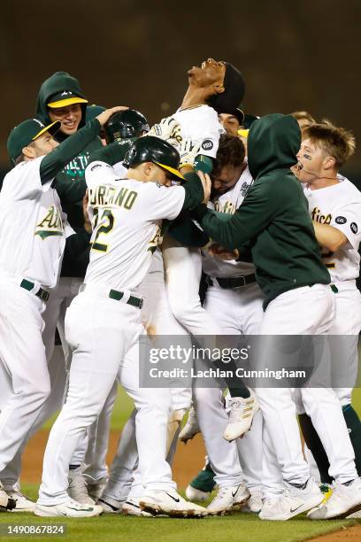 Esteury Ruiz of the Oakland Athletics celebrates after hitting a walk-off single in the bottom of the twelfth inning at RingCentral Coliseum on May...