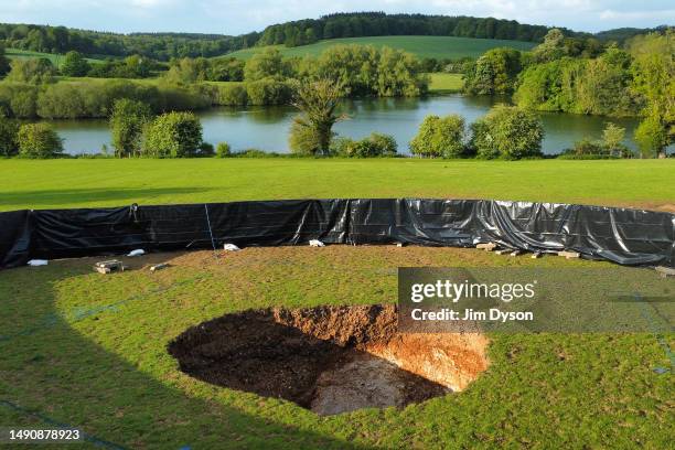 This aerial view shows a large sink hole after it appeared above a section of HS2 tunnelling in a field by Shardeloes Lake, May 16, 2023 in Amersham,...