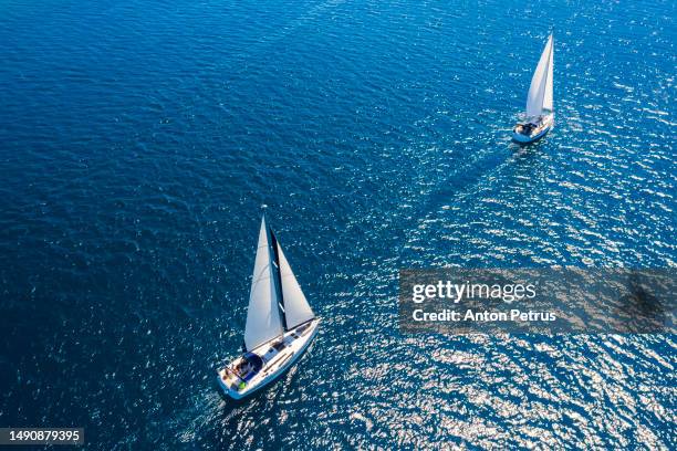 yachts in turquoise water in the caribbean - martinique beach stock pictures, royalty-free photos & images