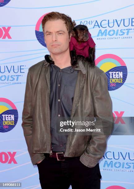 Actor Justin Kirk and Crystal the Monkey arrive at the 2012 Teen Choice Awards at Gibson Amphitheatre on July 22, 2012 in Universal City, California.