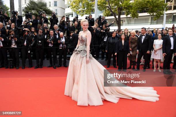 Elle Fanning attends the "Jeanne du Barry" Screening & opening ceremony red carpet at the 76th annual Cannes film festival at Palais des Festivals on...