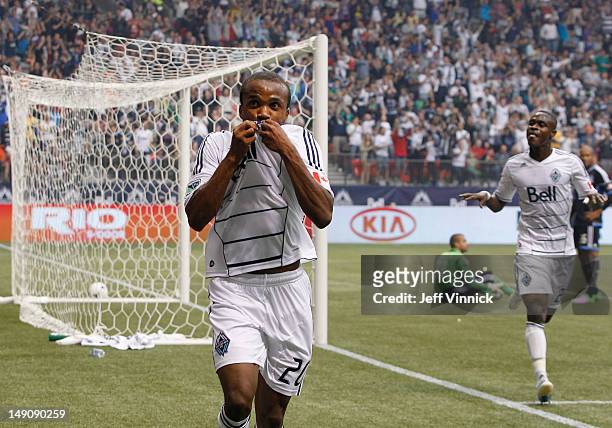 Dane Richards of the Vancouver Whitecaps FC kisses his jersey after scoring during their MLS game against the San Jose Earthquakes July 22, 2012 at...