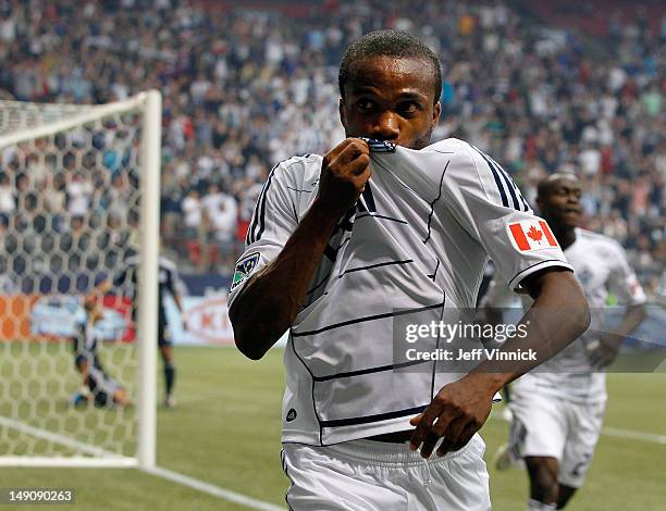 Dane Richards of the Vancouver Whitecaps FC kisses his jersey after scoring during their MLS game against the San Jose Earthquakes July 22, 2012 at...