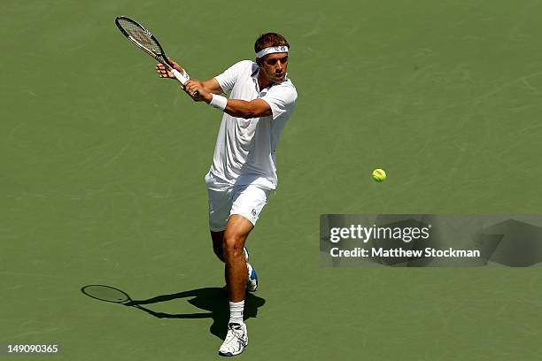 Gilles Muller of Luxemburg returns a shot to Andy Roddick during the finals of the BB&T Atlanta Open at Atlantic Station on July 22, 2012 in Atlanta,...