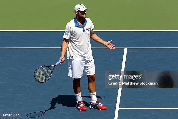 Andy Roddick disputes a call while playing Gilles Muller of Luxemburg during the finals of the BB&T Atlanta Open at Atlantic Station on July 22, 2012...