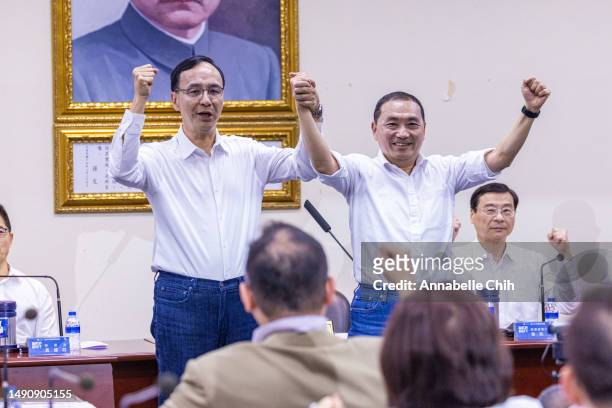 S Presidential candidate, Hou You-ih , hold hands with the KMT's chairman, Eric Chu , at a KMT Central Standing Committee meeting on May 17, 2023 in...