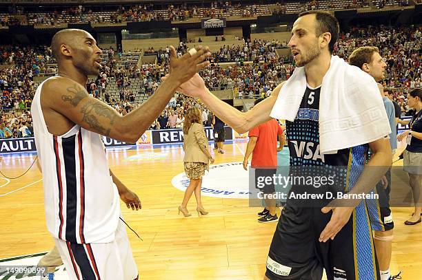 Kobe Bryant of the US Men's Senior National Team and Emanuel Ginobili of the Argentinean Men's Senior National Team shake hands after a game at Palau...