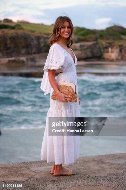 Guest wearing white maxi dress at Afterpay Australian Fashion Week 2023 at Carriageworks on May 17, 2023 in Sydney, Australia.