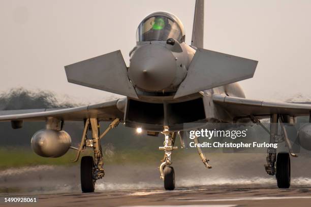 British Royal Air Force Eurofighter Typhoon fighter aircraft lands at RAF Coningsby on May 16, 2023 in Coningsby, England. RAF Coningsby is home to...