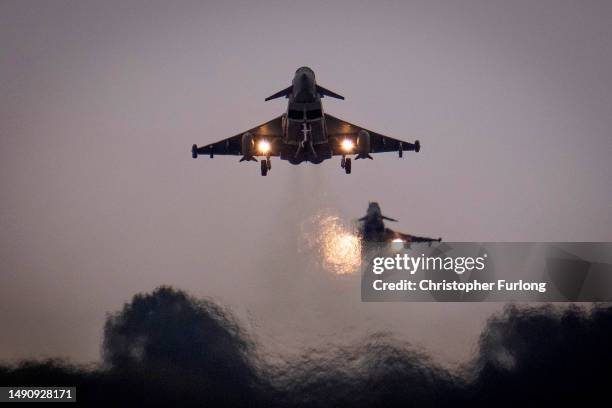 British Royal Air Force Eurofighter Typhoons fighter aircraft fly at RAF Coningsby on May 16, 2023 in Coningsby, England. RAF Coningsby is home to...