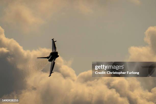 British Royal Air Force Eurofighter Typhoon fighter aircraft flies at RAF Coningsby on May 16, 2023 in Coningsby, England. RAF Coningsby is home to...