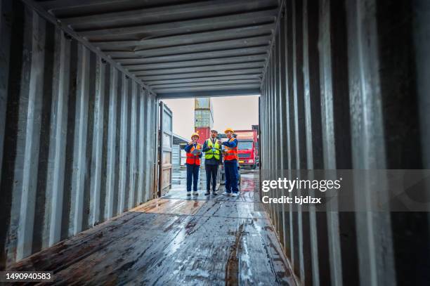 warehouse management personnel are inspecting the panoramic view inside the container - open shipping container stock pictures, royalty-free photos & images