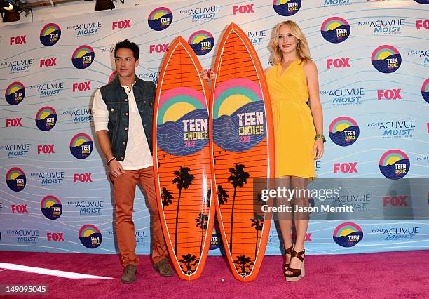 Actors Michael Trevino and Candice Accola, winners of Choice Fantasy/Sci-Fi Show award, pose in the press room during the 2012 Teen Choice Awards at...