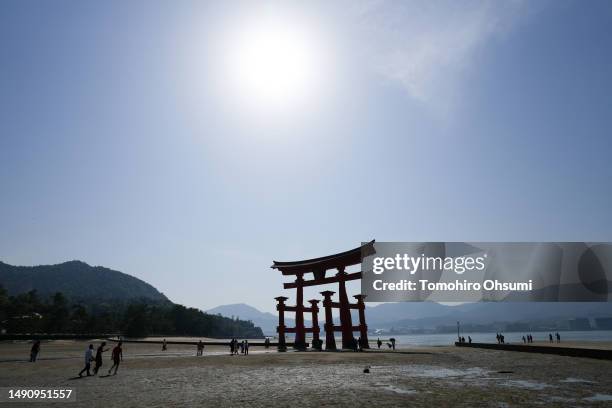 Tourists are seen near the Grand Torii Gate at Itsukushima Shrine on Miyajima Island where leaders of the Group of 7 countries are scheduled to visit...