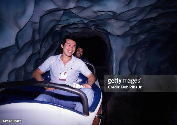 Egyptian Volleyball team members Coach Lin Yuting and Esameldin Ahed Mawad enjoy a ride on Disneyland Matterhorn during visit to the park, July 23,...