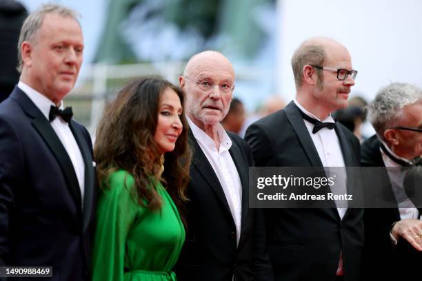 Producer Karsten Brünig, Manuela Lucá-Dazio, Painter Anselm Kiefer and a guest attend the "Anselm" red carpet during the 76th annual Cannes film...