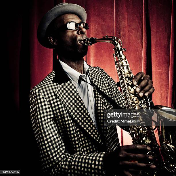 jazzman - saxophone player stock pictures, royalty-free photos & images