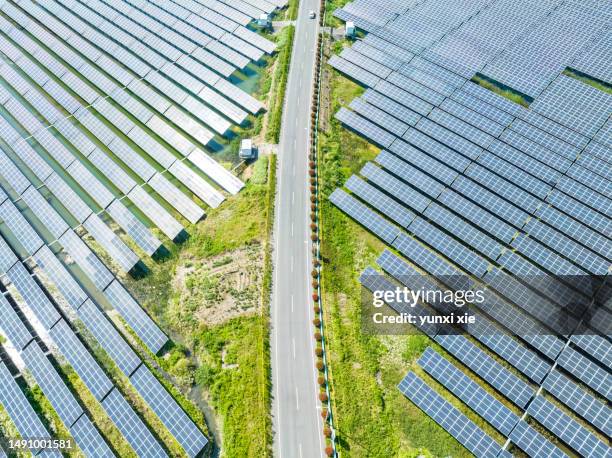 aerial photography of solar panels on the side of the road. - 道端の草地 ストックフォトと画像