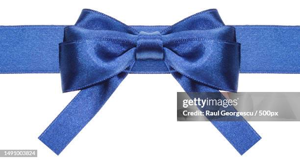 symmetric blue bow with square cut ends on ribbon,romania - hair bow stock pictures, royalty-free photos & images