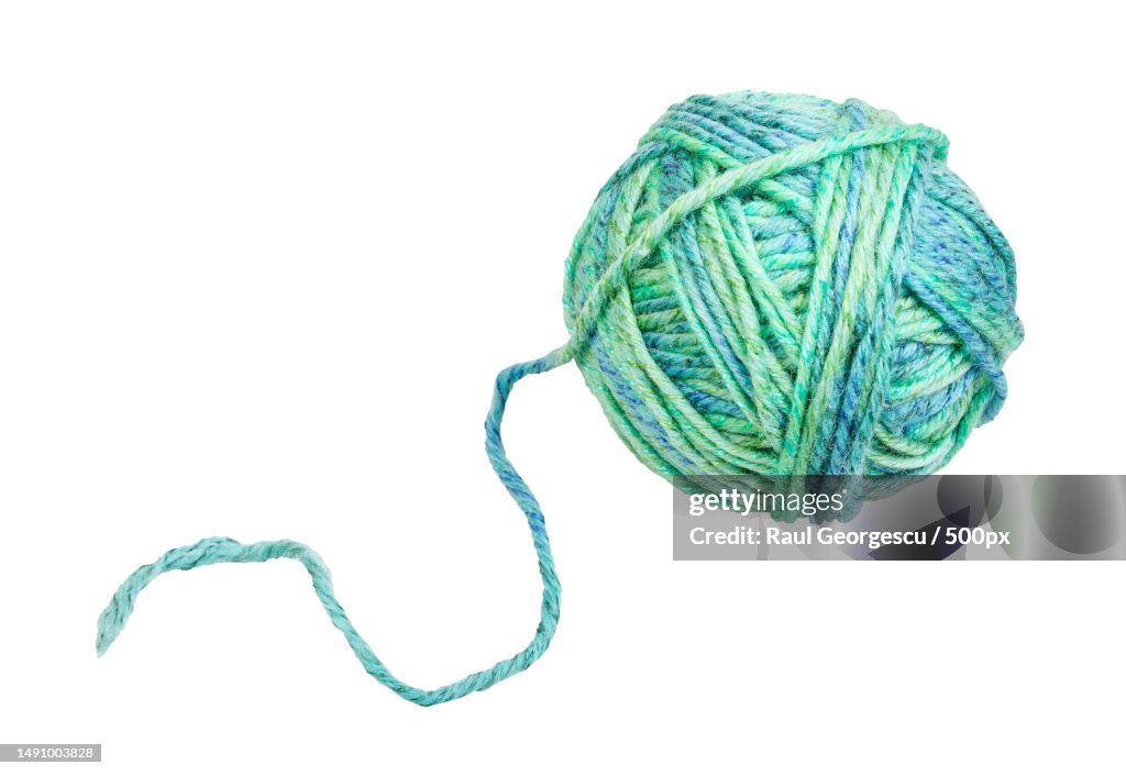 Skein of greenish blue yarn with unwound tail,Romania