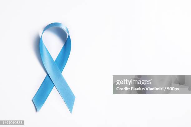 blue ribbon on white background symbol of world diabetes day 14 november,romania - diabetes awareness stockfoto's en -beelden
