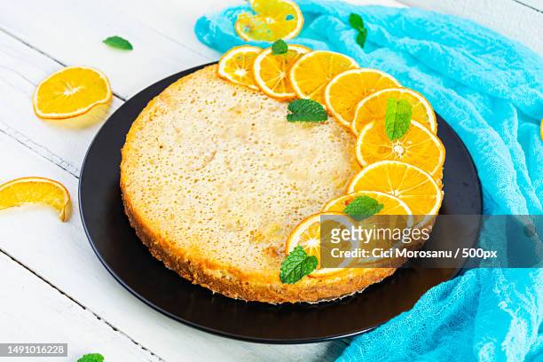 delicious homemade orange tart on wooden background,romania - süßgebäck teilchen stock-fotos und bilder